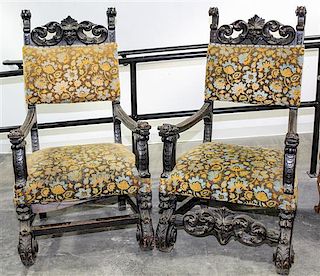 * A Pair of Renaissance Revival Carved Open Arm Chairs. Height 53 1/2 inches.