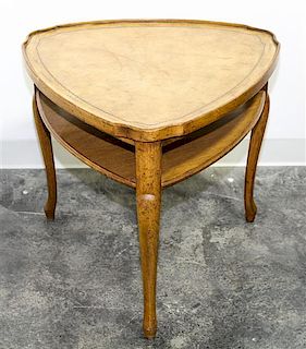 A Triangular Occasional Table. Height 23 inches.