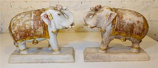 A Pair of Gilt-Decorated Indian Elephant Sculptures Height 13 x width 16 x depth 9 1/2 inches.