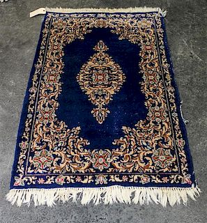A Persian Wool Rug 4 feet 7 inches x 2 feet 10 inches.