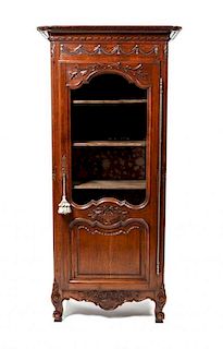 A Louis XV Provincial Style Oak Cupboard, Height 71 x width 27 1/2 x depth 18 3/4 inches.