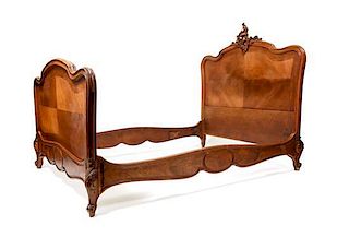A Louis XV Style Bookmatch Veneered Bed, Height of headboard 57 1/2 inches.