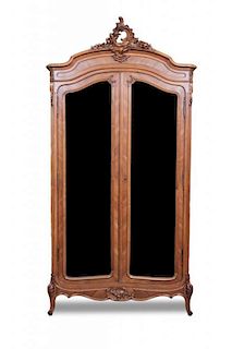 A Louis XV Style Kingwood Armoire, Height 102 x width 49 x depth 19 inches.