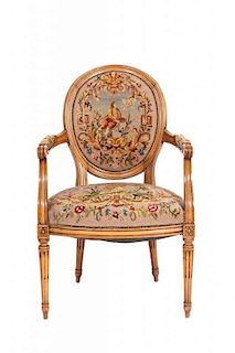 A Louis XVI Style Fruitwood Fauteuil, Height 36 3/4 x width 23 1/2 x depth 21 inches.