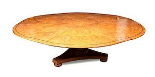 A Biedermeier Style Burlwood Extension Table, Height 29 x diameter 72 inches (without leaves).