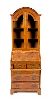 A George II Style Burlwood Secretary Bookcase, Height 79 x width 27 x depth 17 inches.