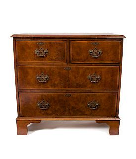 A George II Style Burlwood Chest of Drawers, Height 32 x width 34 x depth 16 inches.