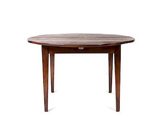 A George III Walnut Breakfast Table, Height 29 1/2 x diameter 47 inches.