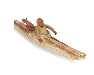 An Eskimo Inuit model kayak with figure