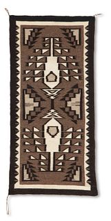 A Navajo Two Grey Hills rug, by Christian Bahe