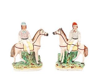 A Pair of Staffordshire Figurines, Height 7 1/4 inches.