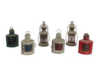 A collection of brass maritime lamps