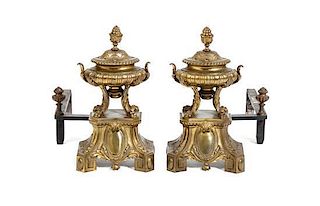 A Pair of Brass Chenets, Height 14 1/2 x width 11 1/4 x depth 21 1/2 inches.