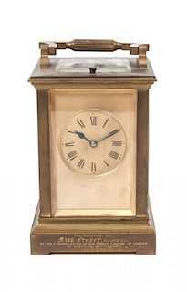 * A French Brass Carriage Clock, E. Maurice & Co., Height over handle 6 1/4 inches.