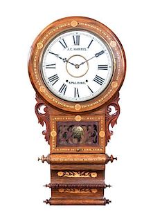 * A Marquetry and Parquetry Decorated Wall Clock, J.C. Harris, Spalding, Height 32 1/2 inches.