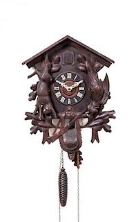 A Hand-carved Wooden Cuckcoo Clock, Height 18 inches.