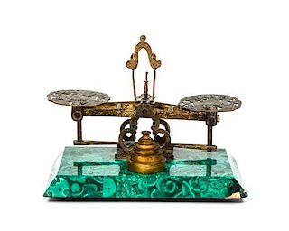 A Malachite and Brass Balance Scale, Height 5 x width 6 1/2 x depth 4 1/4 inches.