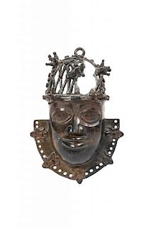 A Benin Bronze Mask, Height 7 1/2 x width 4 3/4 x depth 2 3/4 inches.