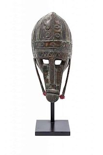 An African Metal-Clad Mask, Height 12 x width 6 x depth 4 1/2 inches.