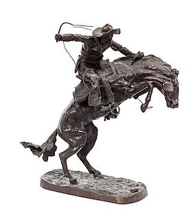 * An American Bronze Figural Group after Remington, Height 21 3/4 inches.
