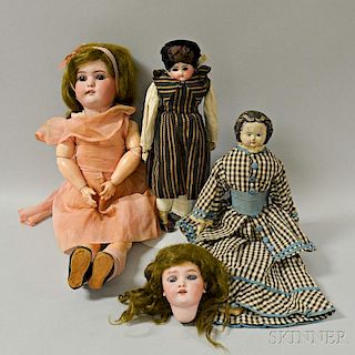 Three Bisque and Composition Dolls, a Bisque Doll Head, and a Trunk of Doll Clothing.