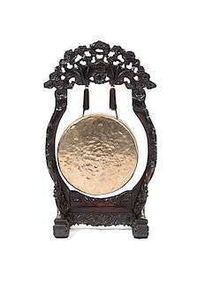 * A Chinese Brass and Carved Hardwood Gong, Height overall 33 inches.