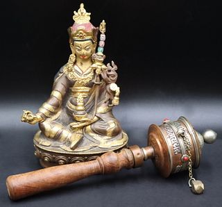 Tibetan Seated Figure and a Prayer Wheel.