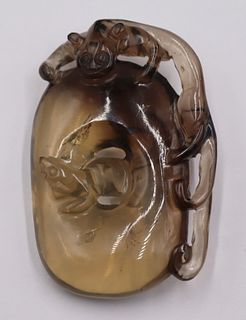 Chinese Carved Tea Crystal Figural Pendant.