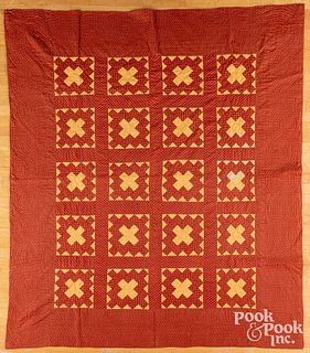 Red and orange pieced quilt