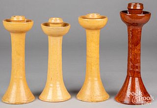 Four Jugtown pottery candlesticks