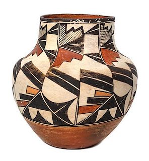 An Acoma Polychrome Olla Height 8 1/2 x 8 1/2 inches.