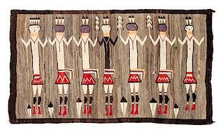 A Navajo Yei Rug 62 X 42 inches.