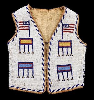 A Northern Plains Beaded Child's Vest Height 17 x width 14 1/2 inches.