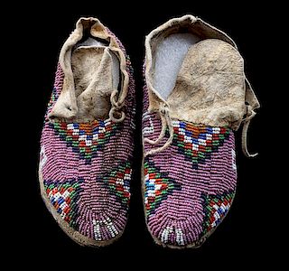 A Pair of Northern Plains Child's Beaded Moccasins Lenght 6 inches.
