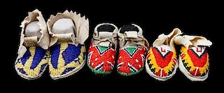 Three Pairs of Northern Plains Beaded Child's Moccasins Length of longest 4 1/4 inches.
