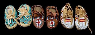 Three Pairs of Northern Plains Beaded Child's Moccasins Length of longest 4 1/2 inches.