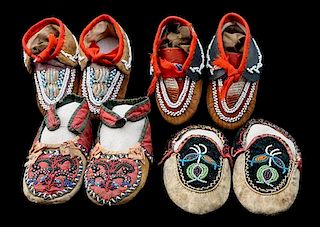 Four Pairs of Great Lakes/ Iroquois Partially Beaded Child's Moccasins Length of longest 6 inches.