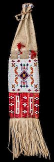 A Sioux Hide, Beaded and Quillwork Tobacco Bag Length overall 32 1/2 inches.