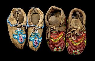 Two Pairs of Beaded Child's Moccasins Lenght of longest 4 1/2 inches.