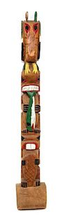 A Pacific Northwest Coast Style Polychrome Totem Height including base 57 1/2 inches.