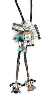 A Zuni Inlaid Eagle Dancer Bolo Height 2 7/8 x width 2 3/4 inches.
