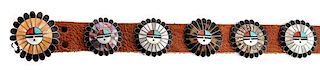 A Zuni Sunface Concho Belt, Attributed to Andrew Lahte Length of belt overall 52 inches; buckle diameter 2 1/2 inches (approx.)
