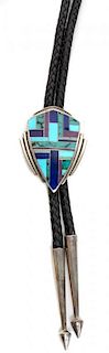 A Zuni Silver and Multiple Stone Inlay Bolo Height 2 3/8 x width 1 3/4 inches.