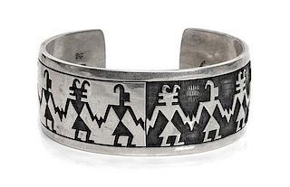 A Hopi Silver Overlay Cuff Bracelet, Bradley Gashwazra Length 6 3/8 x opening 1 x width 1 1/8 inches.