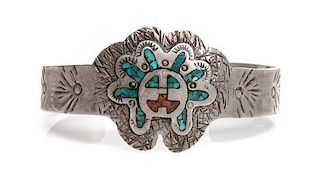 A Hopi Silver, Turquoise and Coral Bracelet Length 5 1/2 x opening 1 1/8 x width 1 1/4 inches.