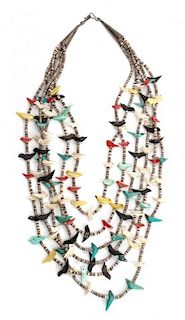 A Six Strand Shell Heishi and Multi-Stone Bird Fetish Necklace Length of necklace 28 inches.