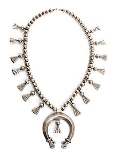 A Navajo Silver Necklace Length 22 inches; height of naja 3 inches.