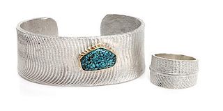 A Sand-Cast Silver, 14 Karat and Lander County Turquoise Bracelet, Cheyenne Harris Length 5 3/4 x opening 7/8 x width 1 inches.