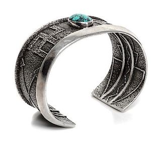 A Navajo Tufa Cast Silver and Turquoise Bracelet, Aaron Anderson (b. 1970) with Original Mold Cast Length 5 1/2 x opening 1 inch