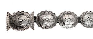 A Navajo Second Phase Style Concho Belt and Matching Buckle Length 34 inches; height of buckle 3 x width 4 inches.
